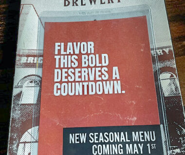 Front page of Bricktown Brewery menu. Words say Flavor this bold deserves a countdown. Background is of a building and Bricktown Brewery is the heading.